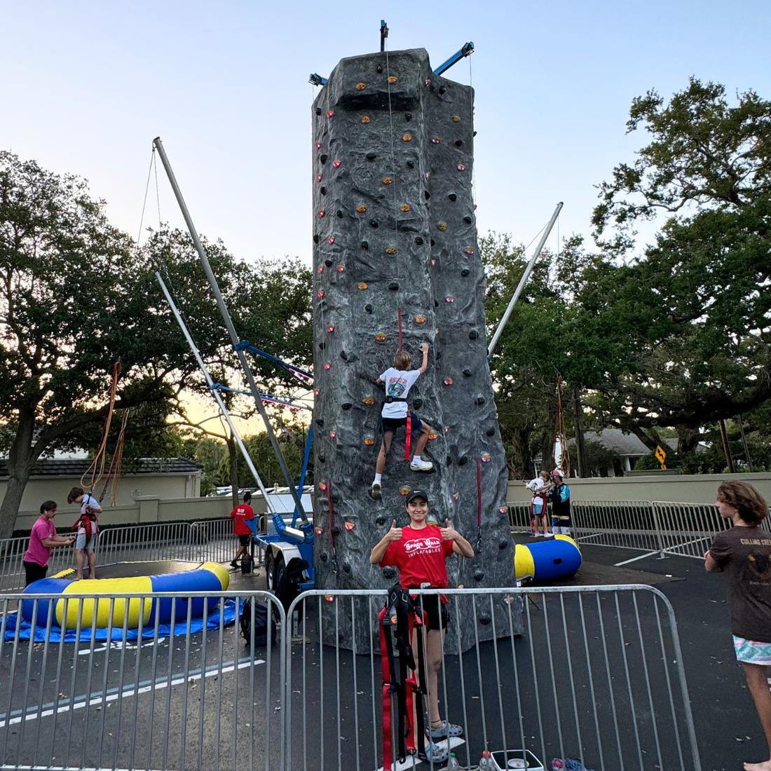 woman standing in front of the rock wall rental