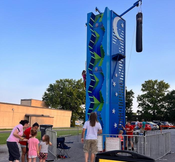 Family looking up at the Leap of Faith ride rental