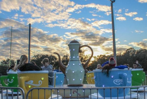 teacups ride rental set up with riders enjoying the ride